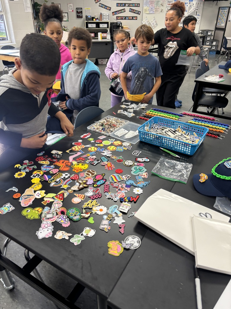 Leaders select the patches and accessories for their hat