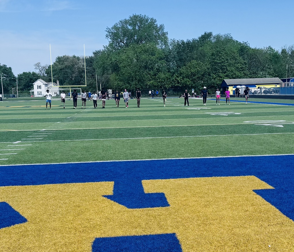 Runners warming up on the field