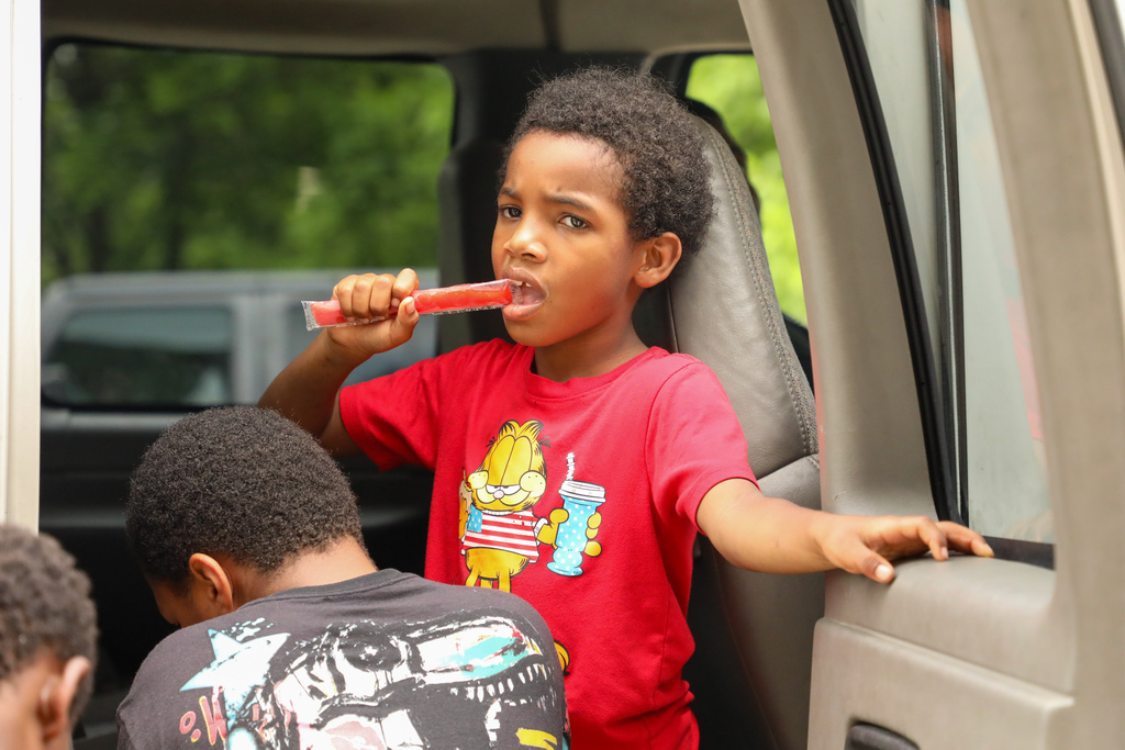 Boy eating a popsicle.