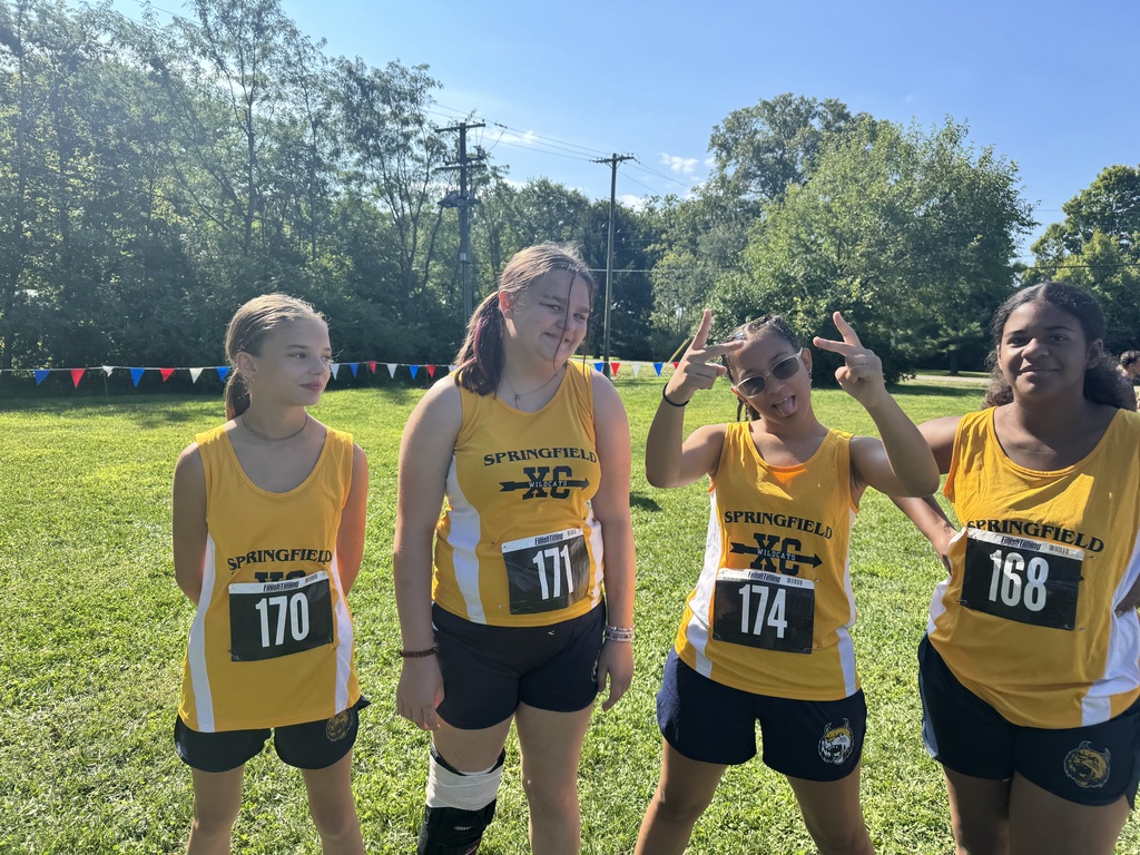 Four female runners getting ready for their race 