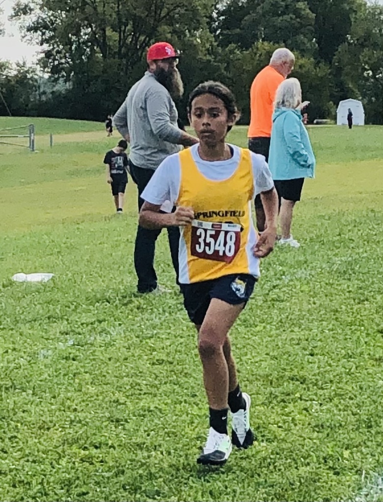 Female runner on a grassy course