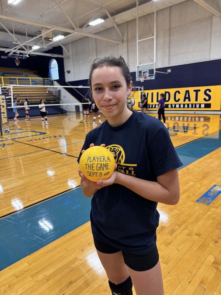 Levi Daniel holds her game ball