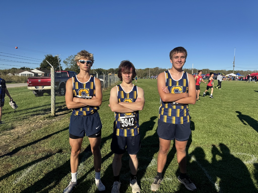 Three high school runners preparing to run their race