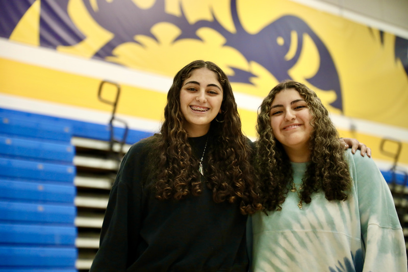 Nyah and Mya Khasib try to hold back laughter while taking a picture together