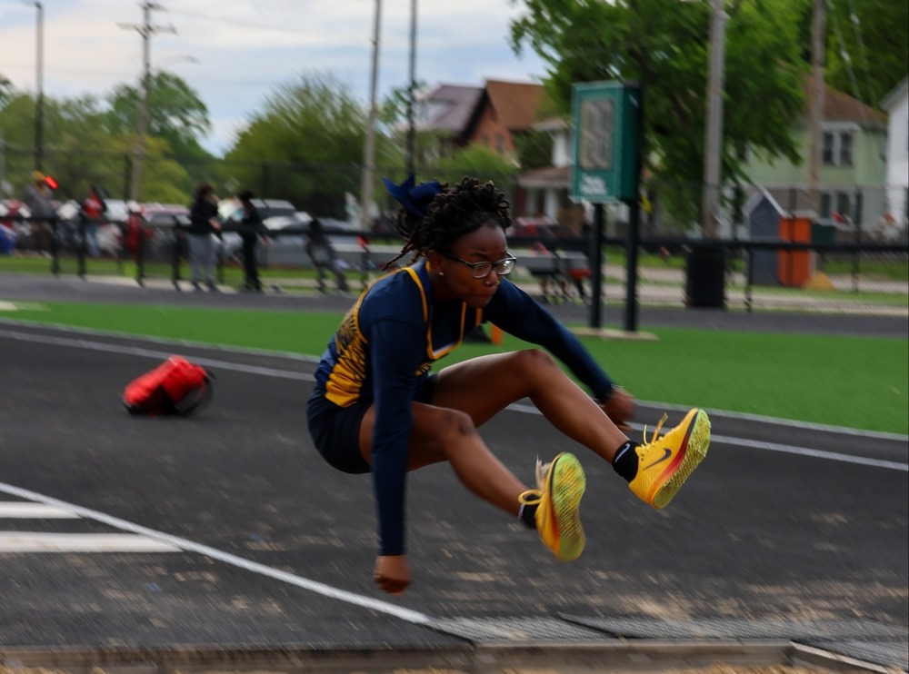 girl doing triple jump