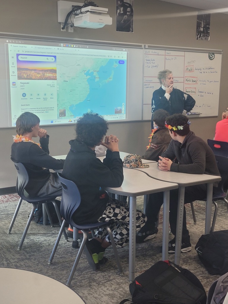 Picture of Debbie Kuroiwa presenting to a class of students