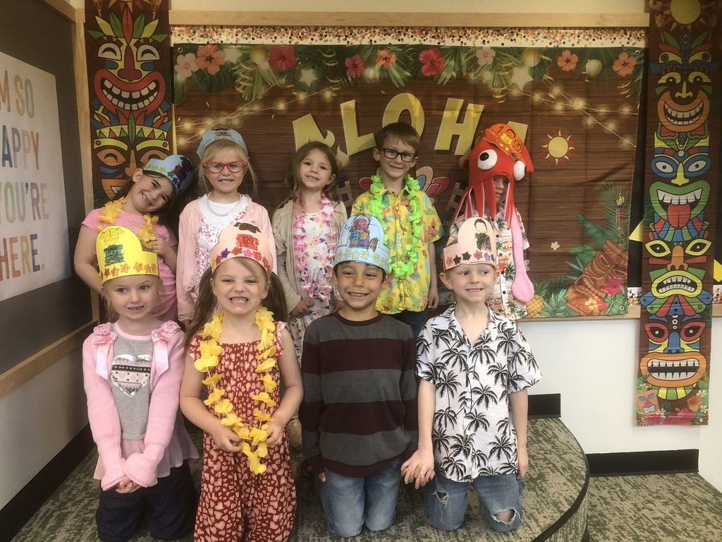 picture of students wearing leis and crowns for 100 day