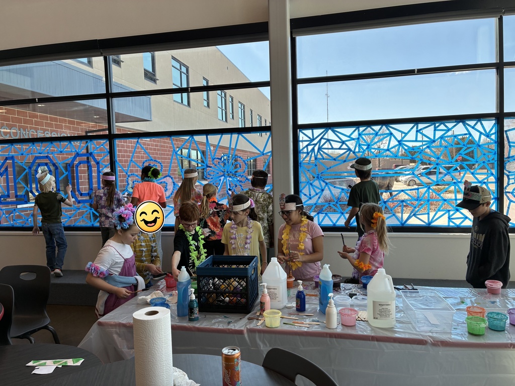 picture of students painting on windows