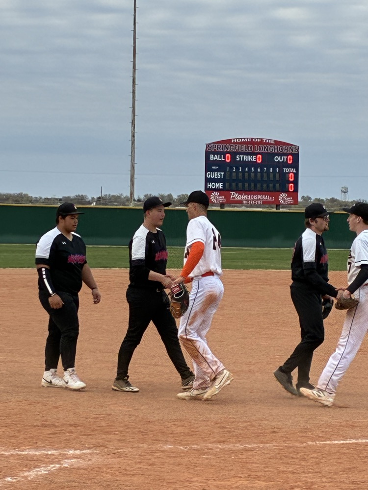 picture of baseball players and the new scoreboard in the background 