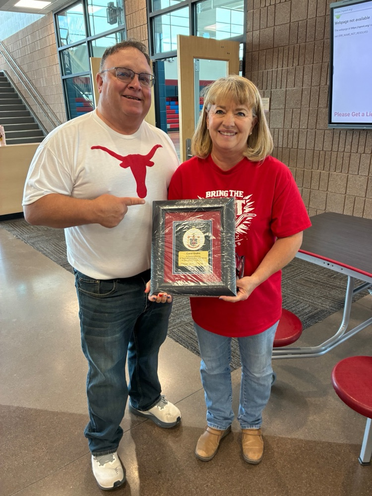 Supt. Kurt Baxter presenting an award to Carol Grahn for 35 years of service to SPRE4
