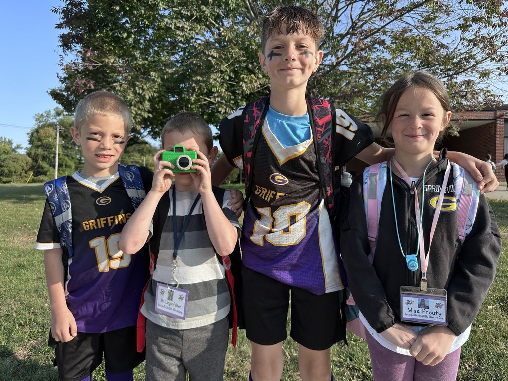 football players, coach and photographer