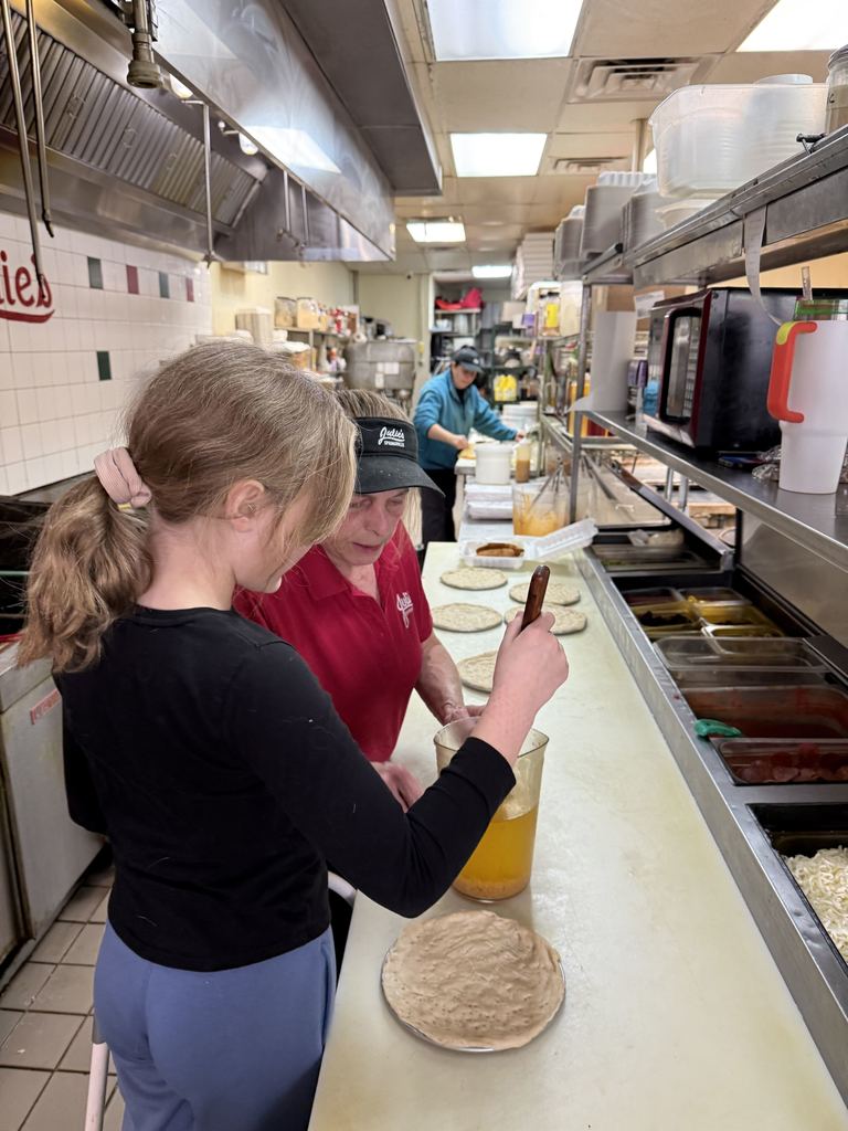 student makes a pizza.