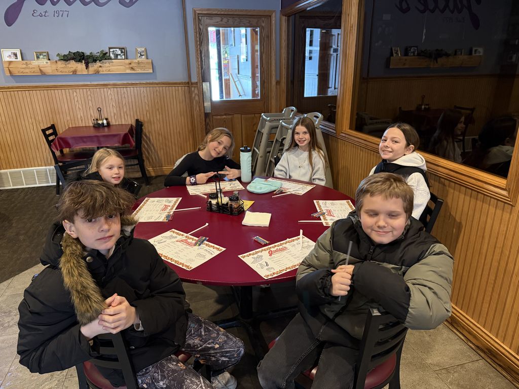 students sit at the table.