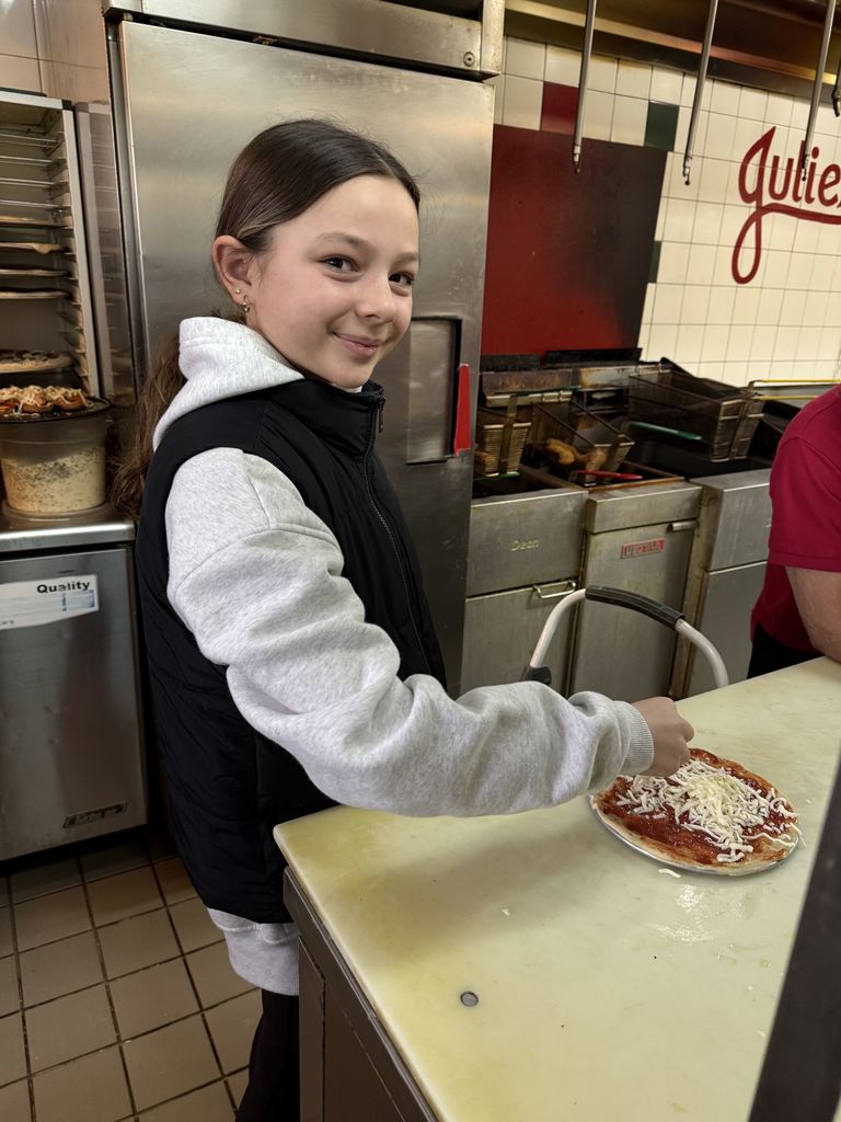 student makes a pizza.