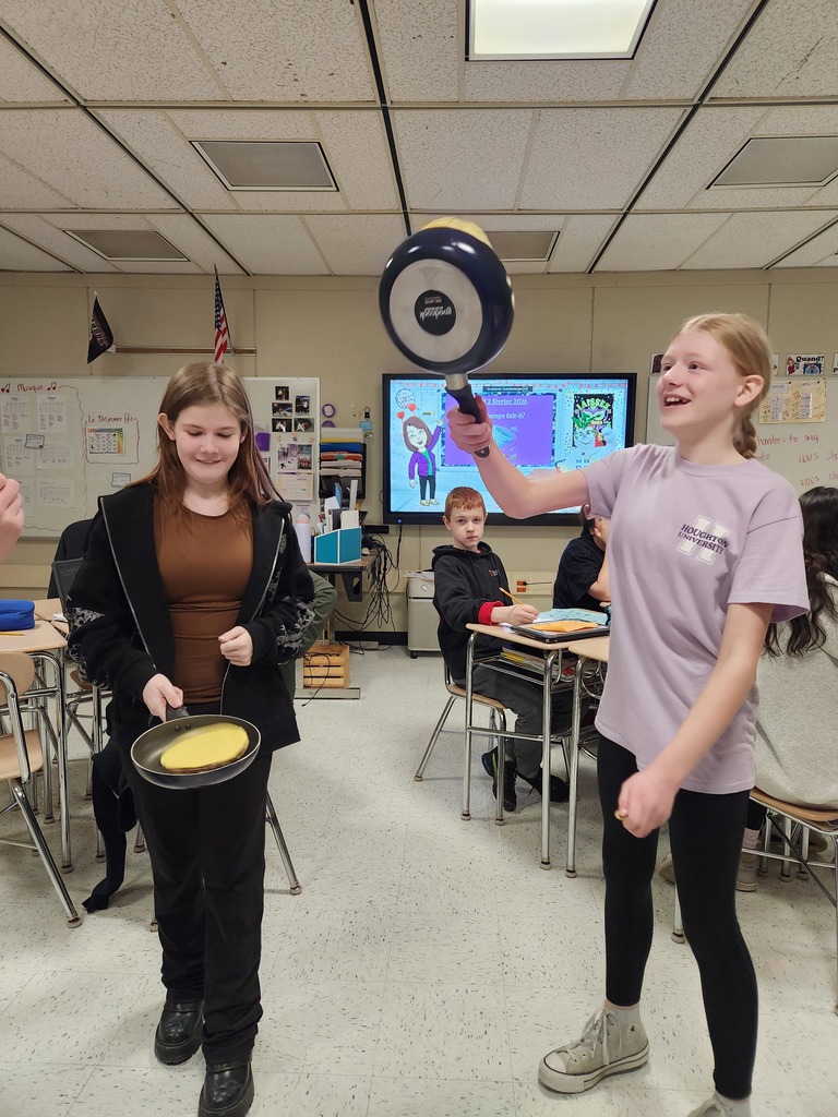 Students flip crepes.