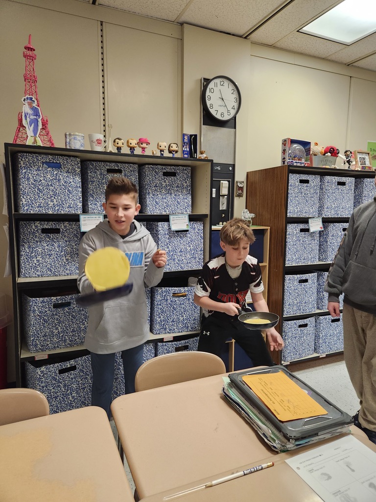 Students flip crepes.