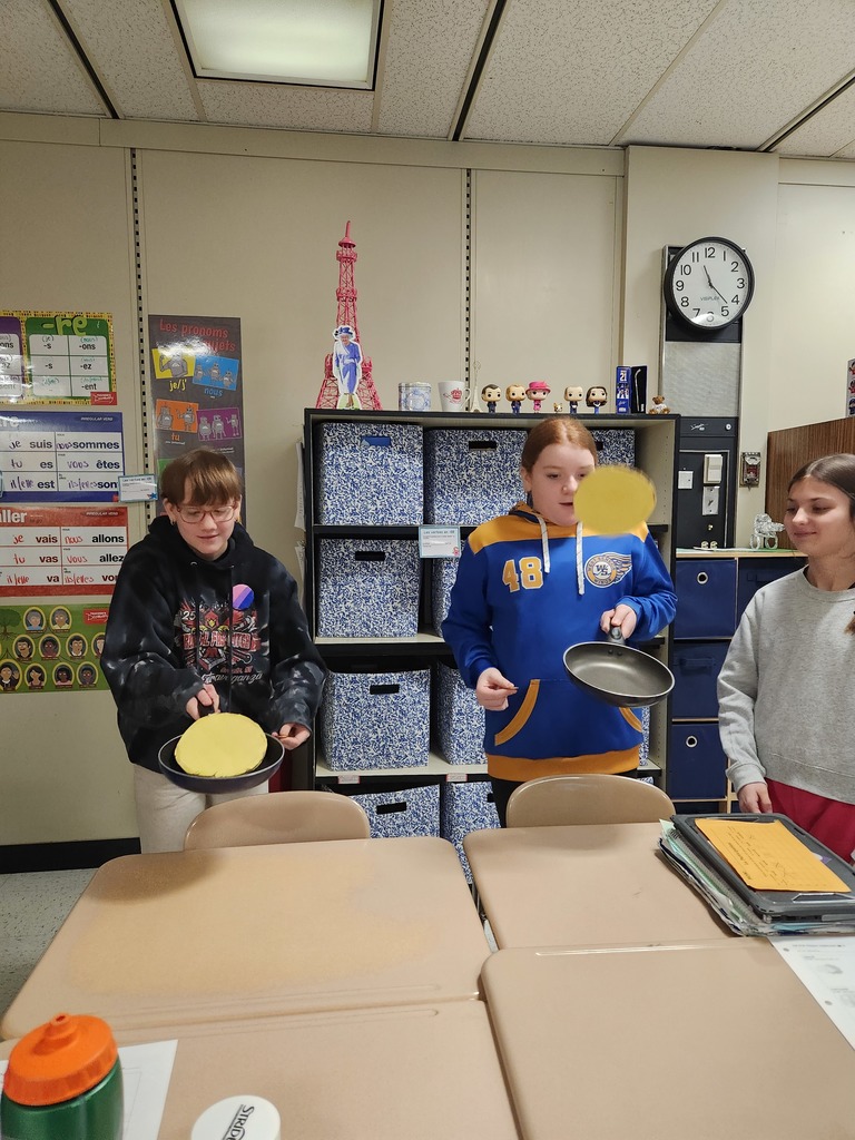 Students flip crepes.