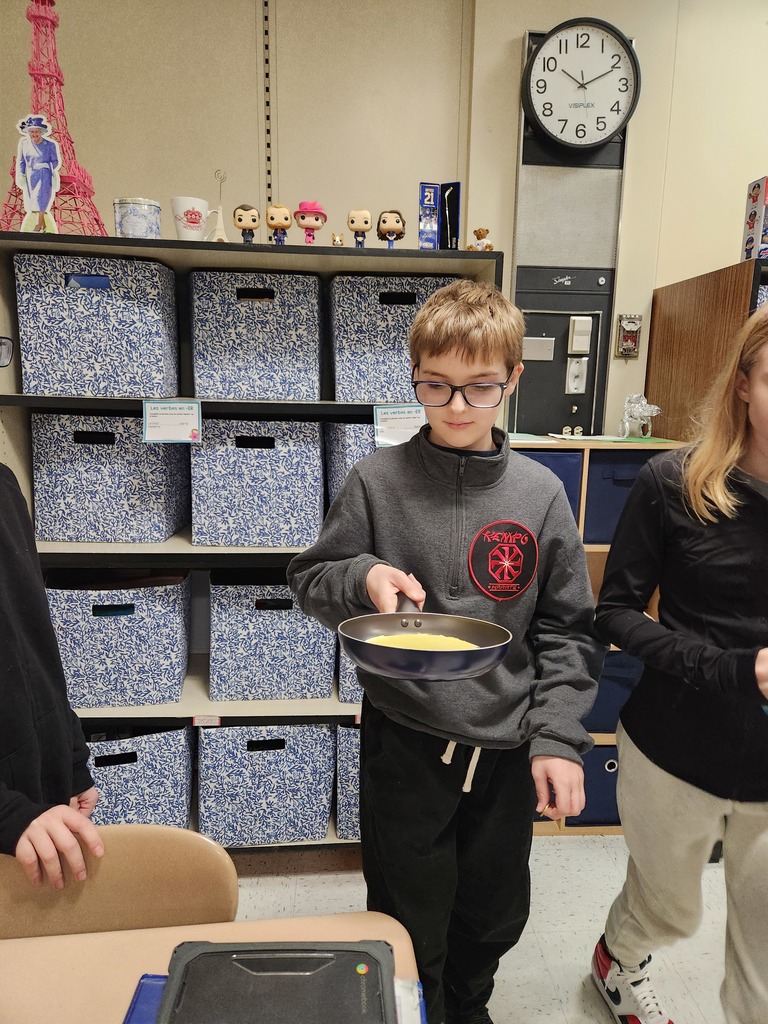 Students flip crepes.