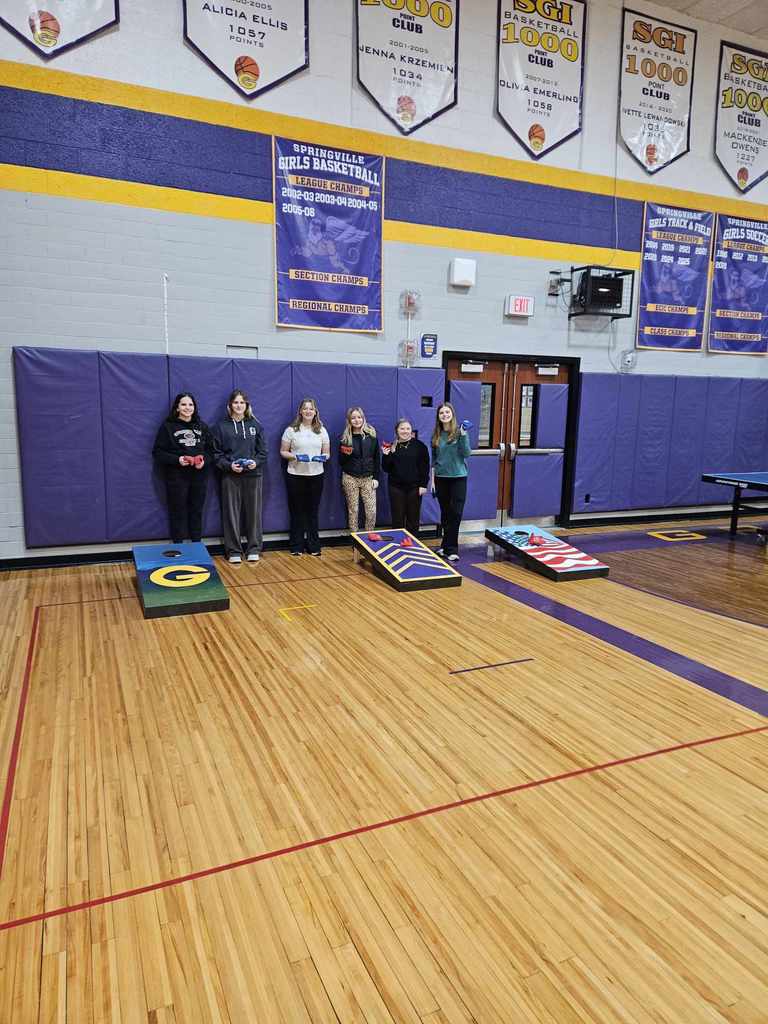 students with cornhole games.