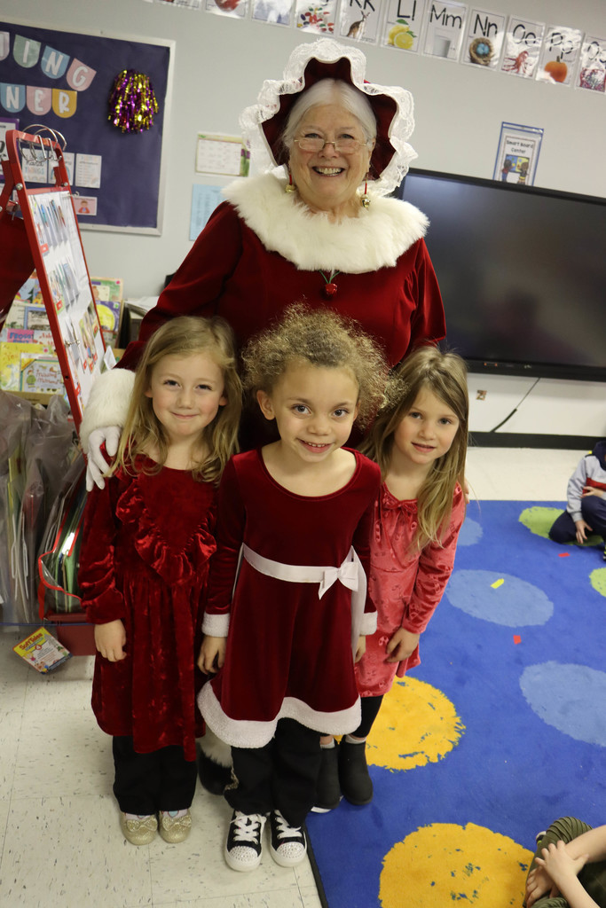 Mrs. Claus poses with students.