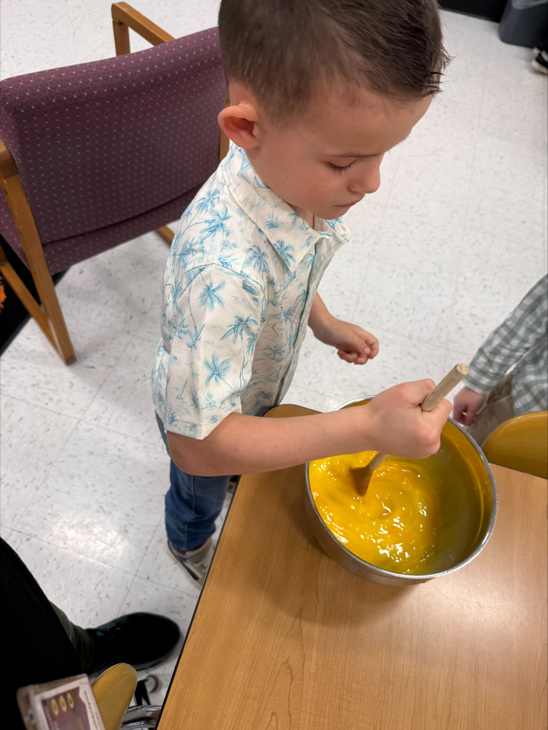 s student stirs eggs