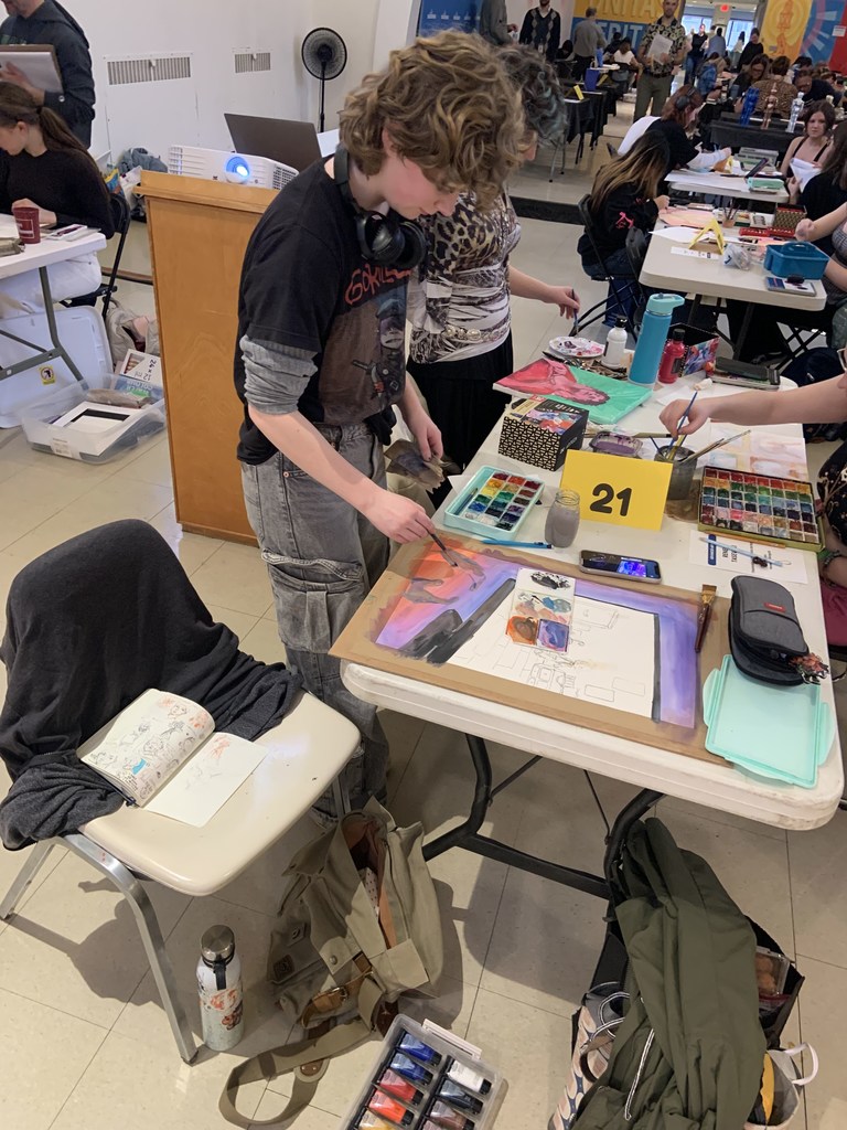 student working on art