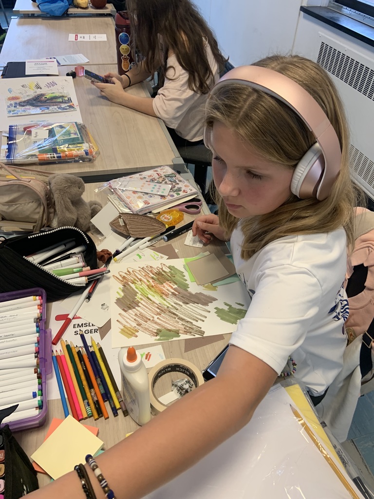 student working on art