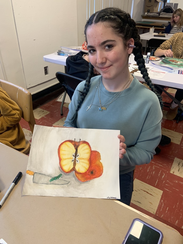 student working on art