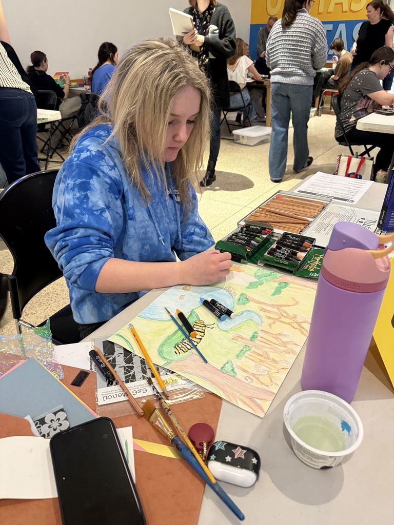 student working on art