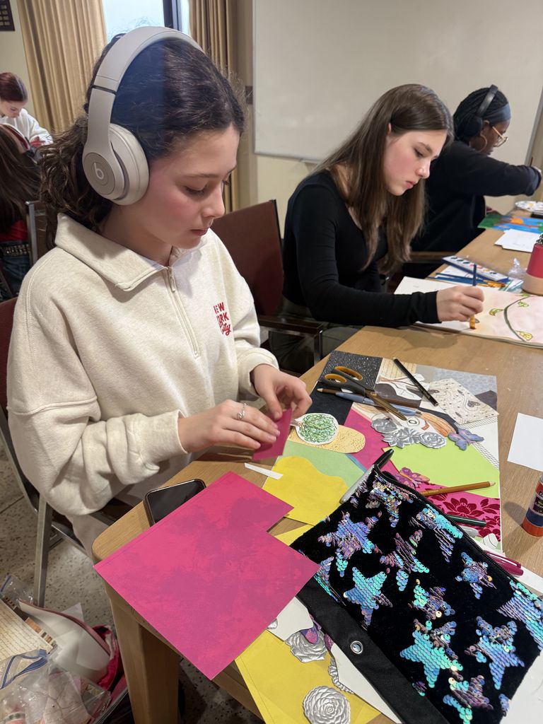 student working on art