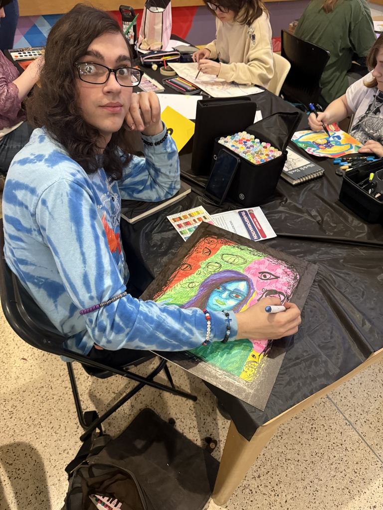 student working on art