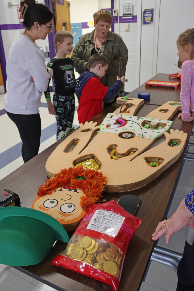 students play a life size operation game.