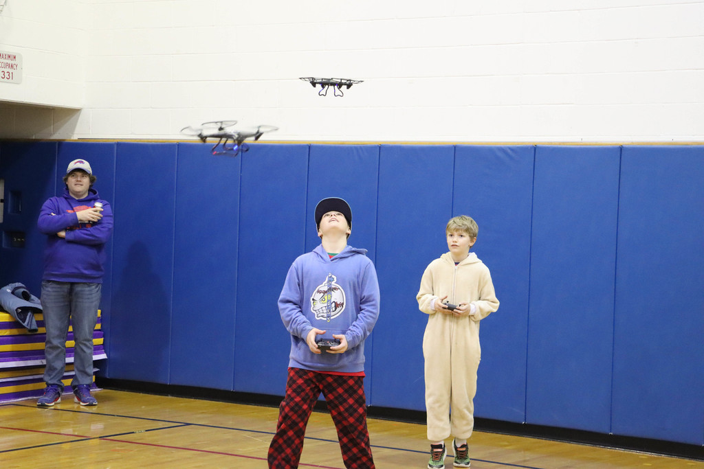 students fly drones. 