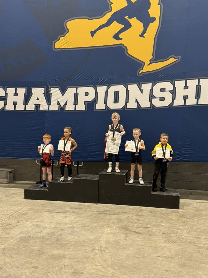 youth wrestlers on podium