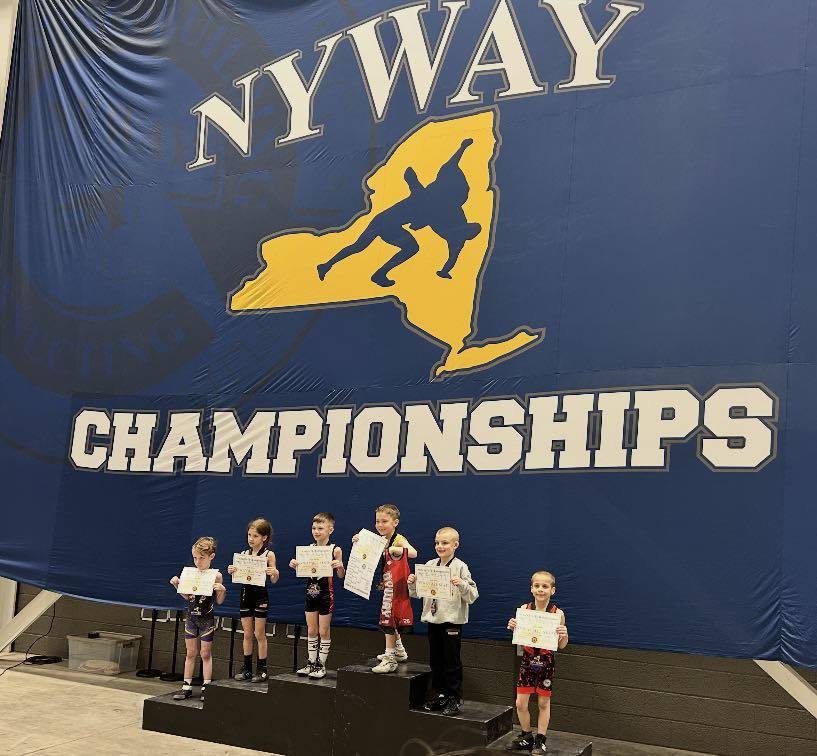 youth wrestlers on podium