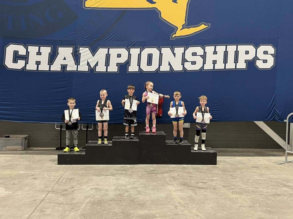 youth wrestlers on podium