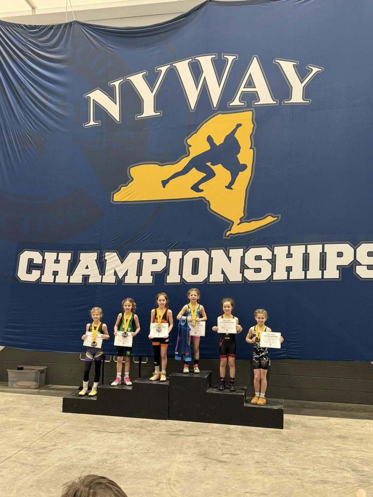 youth wrestlers on podium