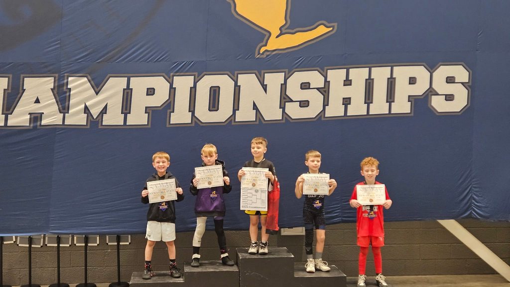 youth wrestlers on podium