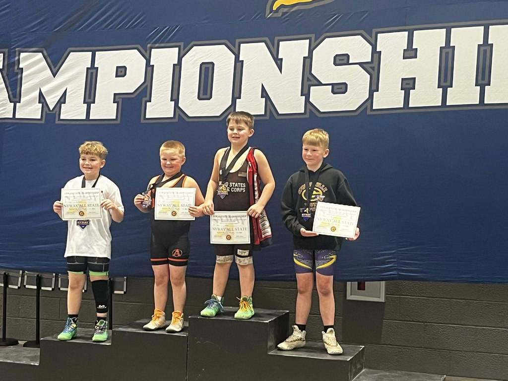 youth wrestlers on podium