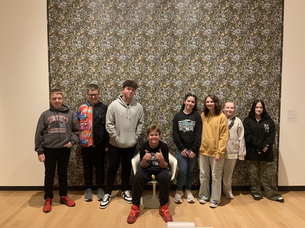 students pose at the museum. 