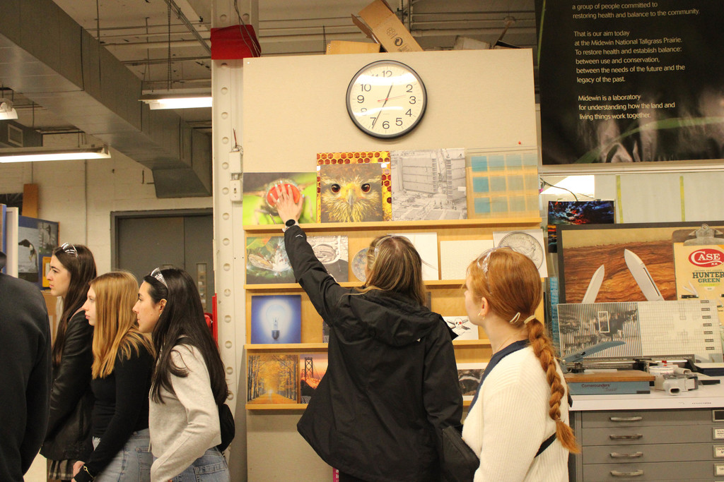 Students look at art