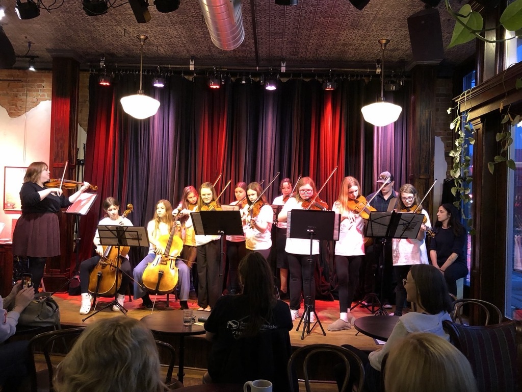 Fiddlers play their instruments