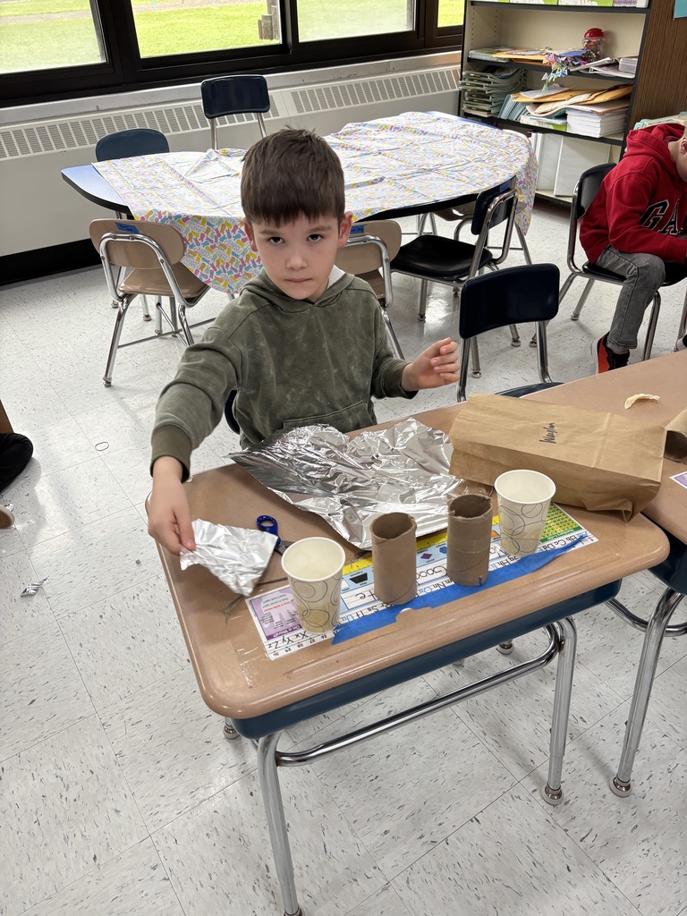 a student works on his egg drop experiment