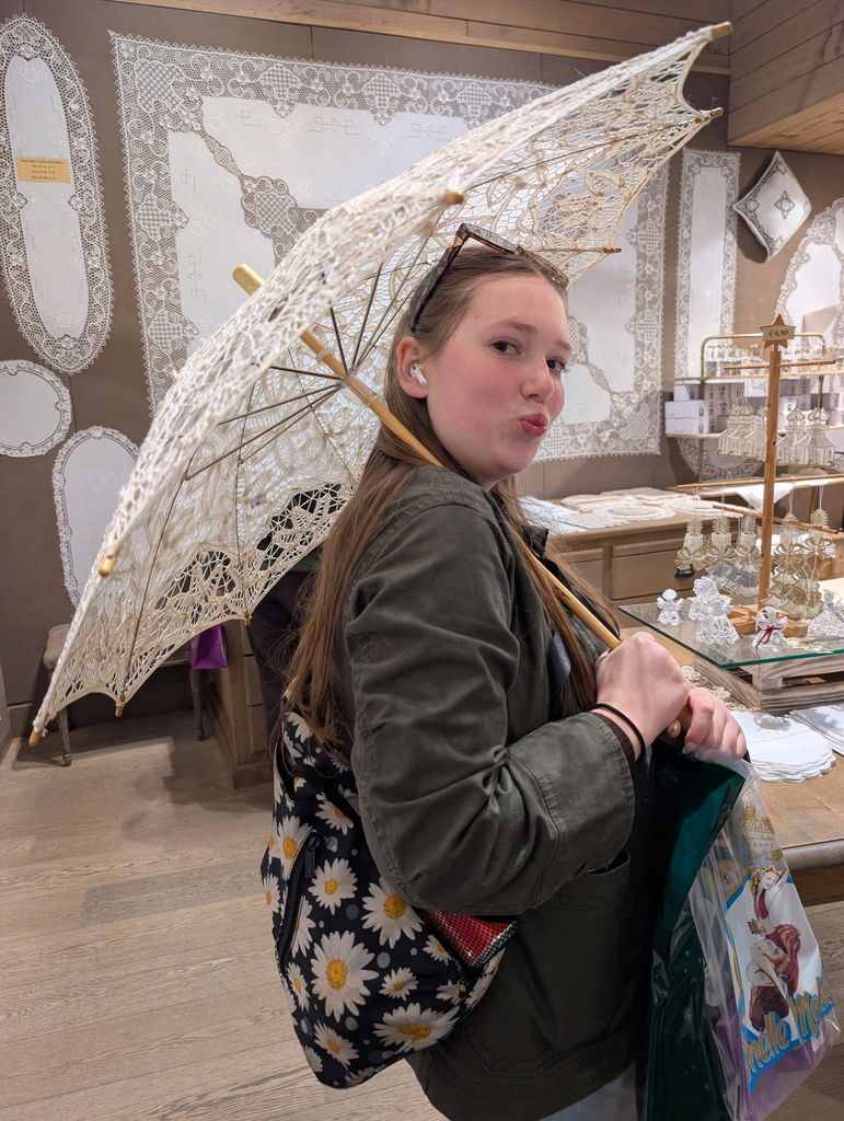 A student holds a parasol 