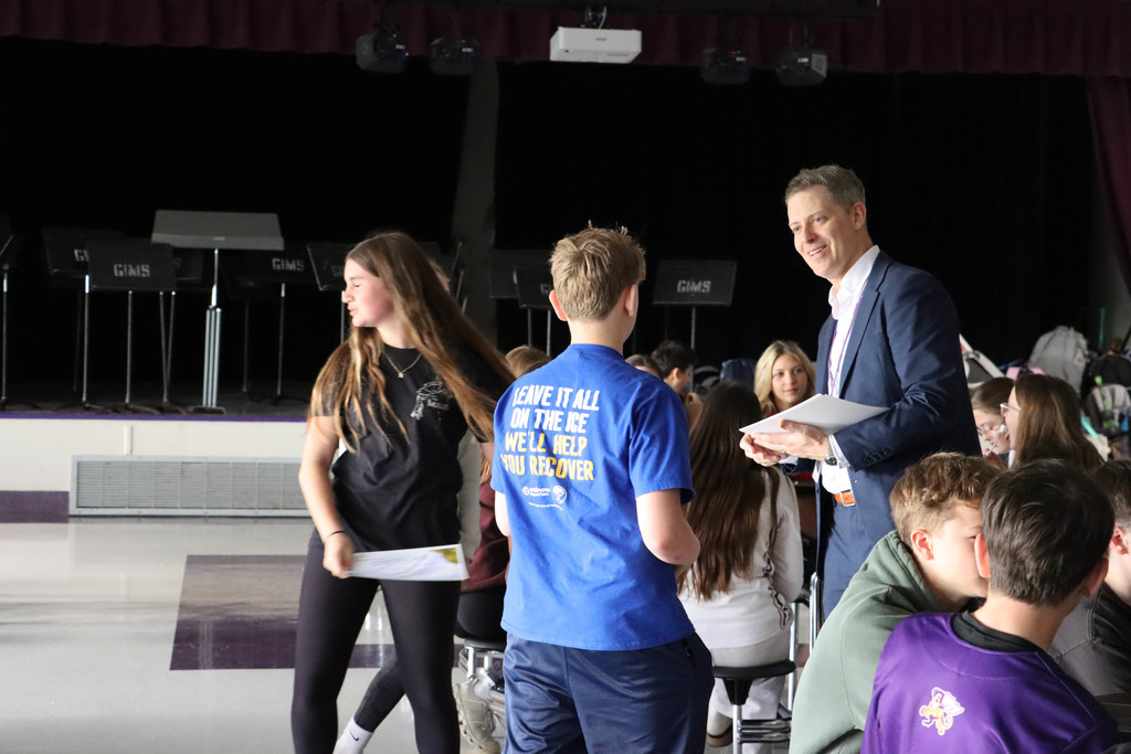 Dr. Fisher hands out certificates. 