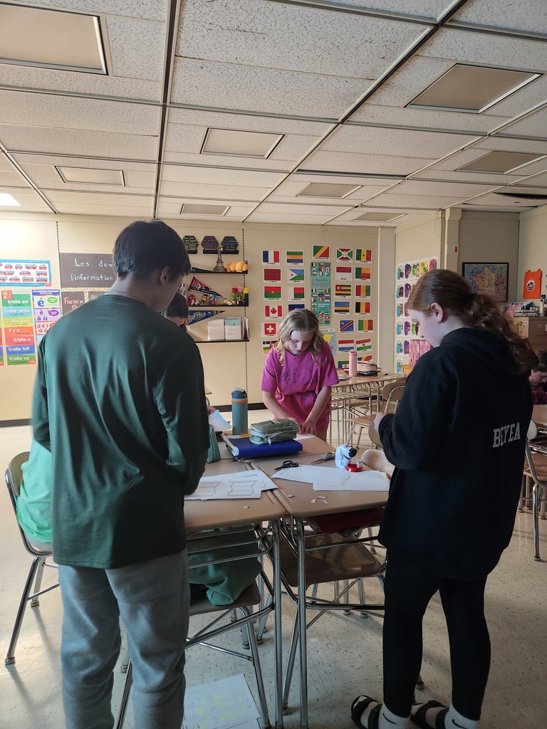 French students working on flags. 