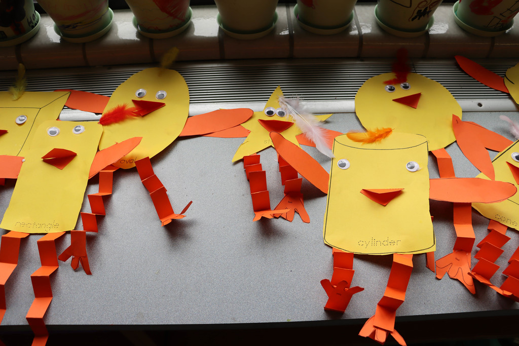 The chicken craft made by students included shapes of construction paper. 