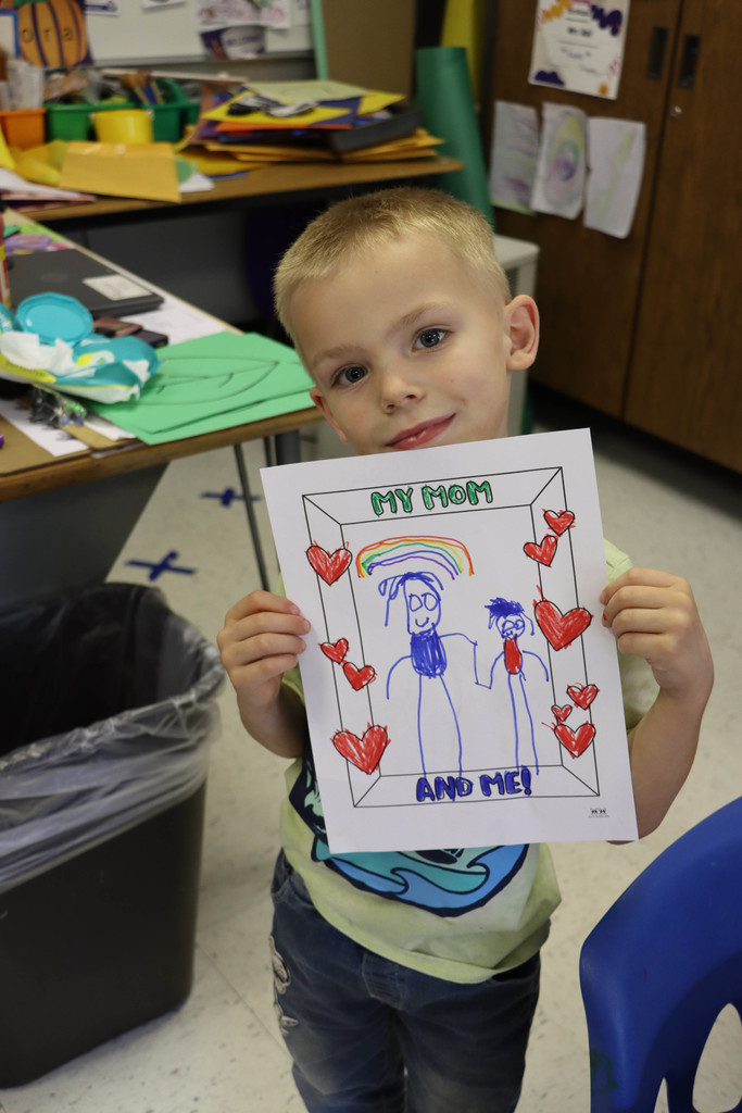 A student holds up a picture.