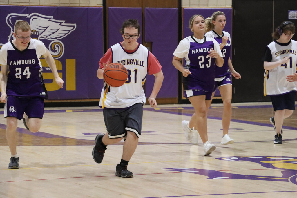 SGI dribbles the ball down the court. 