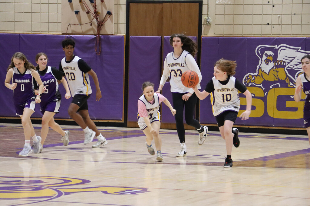 SGI dribbles the ball down the court. 